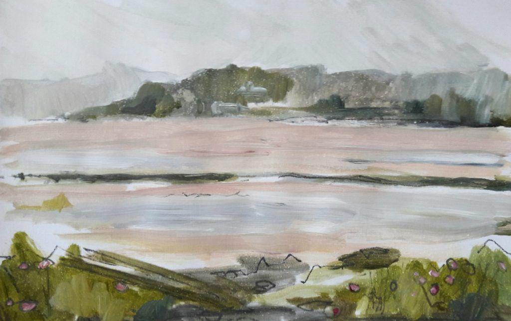 View over estuary with misty hills beyond