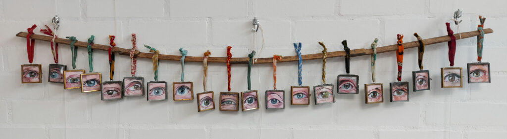 A selection of framed Eye Contact paintings