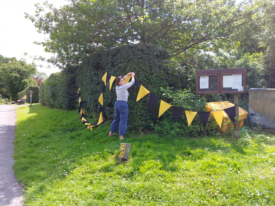 Tabitha putting up the bunting