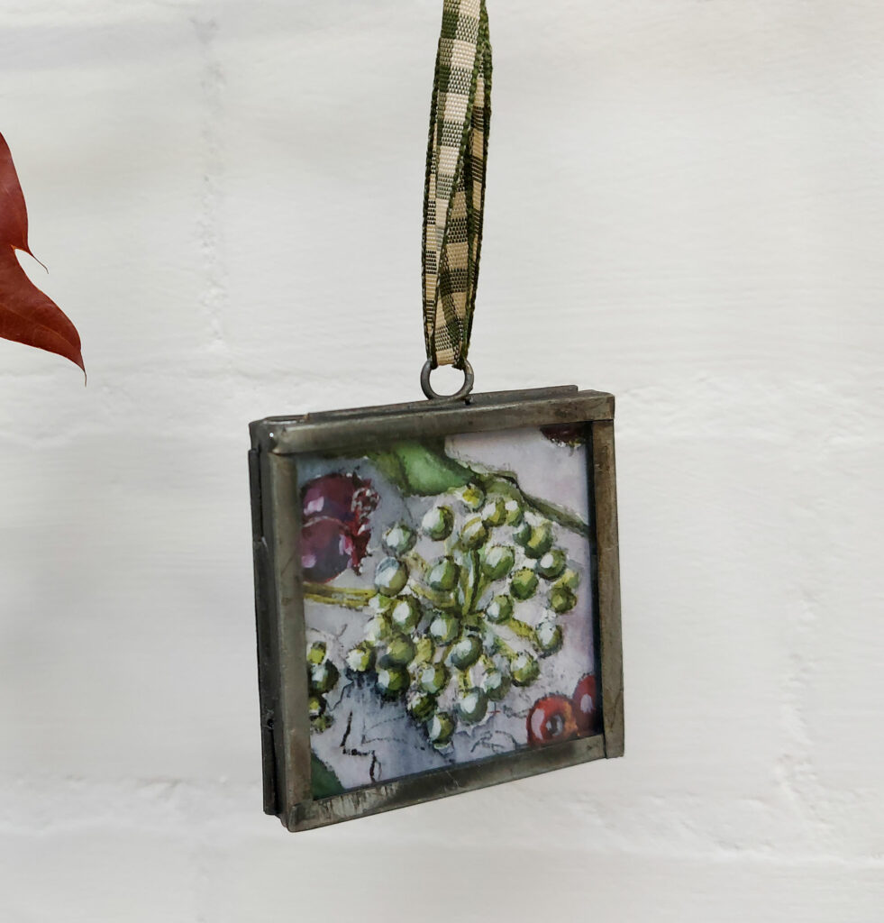 Ivy design, in a zinc frame with green gingham ribbon